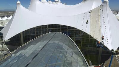 The tents that crown the Denver airport’s main terminal are meant to mimic the surrounding mountains. Work to reconfigure the terminal is ongoing. Andy Cross / Getty Images