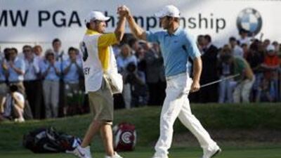 Paul Casey, right, celebrates winning with his caddie Craig Connelly on the 18th green on the final day of the PGA Championship on the West Course at Wentworth.