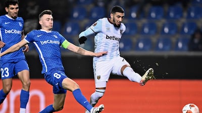 West Ham's Algerian forward Said Benrahma (R) shoots to score a goal during the UEFA Europa League Group H match between KRC Genk and West Ham United, at The Cegeka Arena in Genk, on November 4, 2021. (Photo by JOHAN EYCKENS / Belga / AFP) / Belgium OUT