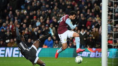 Mahmoud Trezeguet avoids the challenge of Ricardo Perreira to score the winning goal during the League Cup semi final at Villa Park. Getty Images