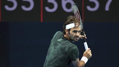 Roger Federer hits a backhand during a training session. Julian Smith / EPA