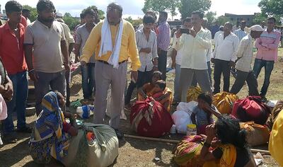 This photo taken on July 1, 2018 shows Indian village leaders speaking to the relatives of men killed in a lynching incident in Dhule district, some 330 kilometres (205 miles) from Mumbai. Indian police said July 2 they have arrested 23 people after five men were bludgeoned to death by a crazed mob in yet another horrific lynching to rock the country. / AFP / -
