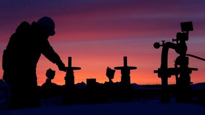 A worker checks the valve of an oil pipe at an oil field owned by Russian state-owned oil producer Bashneft near the village of Nikolo-Berezovka, northwest of Ufa, Bashkortostan, Russia. Reuters