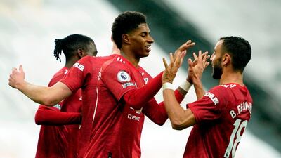 Manchester United's English striker Marcus Rashford (centre) celebrates the win. AFP