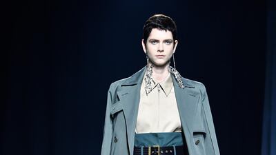 Givenchy present a lesson in power dressing, matching high waisted trousers with slick trench coats. Pascal Le Segretain. Getty Images