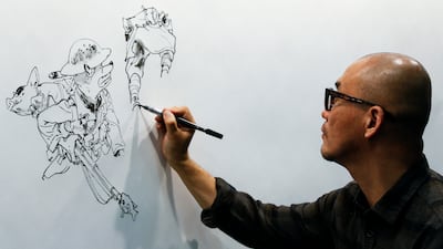 South Korean comic artist Kim Jung Gi draws during the 35th Comic Fair 2017 in Barcelona on March 30, 2017. AFP