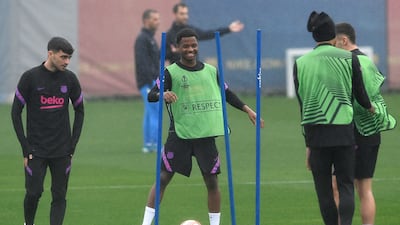 Barcelona midfielders Pedri, left, and Ansu Fati train for the Europa League quarter-final second leg game against Eintracht Frankfurt. AFP