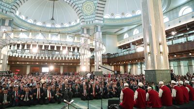 Turkish President Recep Tayyip Erdogan (back-C), praying on the third anniversary of the failed coup attempt at the Millet (Nation) mosque in Ankara, Turkey. EPA