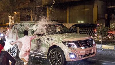 Residents celebrate the 45th UAE National Day along the Ajman Corniche. Navin Khianey / The National