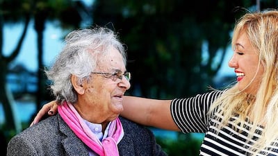 Syrian poet Ali Ahmad Said Esber with Rym Ghazal. Satish Kumar / The National