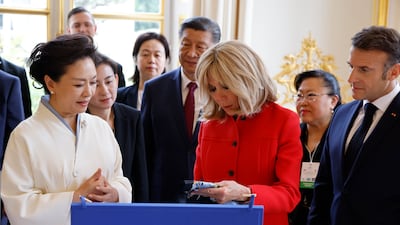 The Chinese and French presidential couples exchange gifts on behalf of their countries at the Elysee Palace. EPA