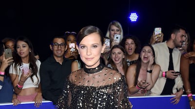 Millie Bobby Brown, wearing a tulle black and gold dress, attends the MTV Video Music Awards in Inglewood, California, on August 27, 2017. Getty Images