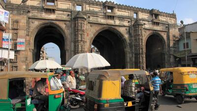 Autorickshaws in Ahmedabad. Located on the banks of the Sabarmati River, the Indian city is a major hub for the textiles trade. Alamy