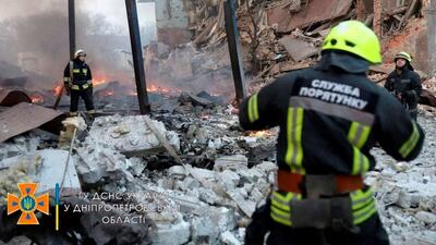 Rescuers work among remains of buildings damaged by an air strike in Dnipro, Ukraine, as Russia's attack on the country continues. Reuters