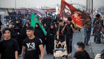 Shiite Muslim pilgrims march from Iraq's capital Baghdad on their way to Karbala on Monday. AFP