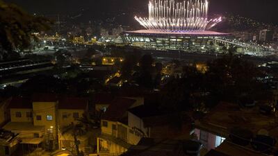 The Mangueira slum is backdropped by fireworks exploding above the Maracana stadium during the opening ceremony of the Rio’s 2016 Summer Olympics in Rio de Janeiro in Rio de Janeiro, Brazil. Leo Correa / AP photo