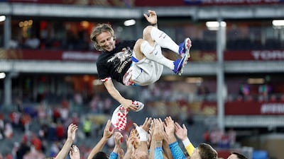 Croatia's Luka Modric is thrown into the air by teammates as they celebrate his 200th appearance for Croatia after the match against Panama. Reuters