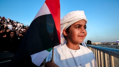 Children waved flags as they watched the parade's events unfold
