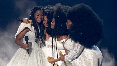 From left: Faith Fennidy, Madeline Edwards, Mickey Guyton and Brittney Spencer embrace after a performance. AP
