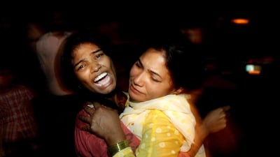 Women comfort each other as they mourn over the death of a family member in a Taliban suicide bombing in Lahore on March 27, 2016. K M Chuadary / AP Photo