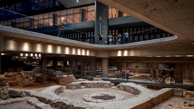 Visitors view the excavation site beneath the Museum of Acropolis in Athens, Greece, in June 2019. AFP
