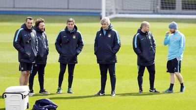Manchester City’s manager Manuel Pellegrini (C) during training. Jason Cairnduff / Action Images