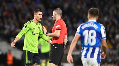 United striker Cristiano Ronaldo talks with the referee. AFP