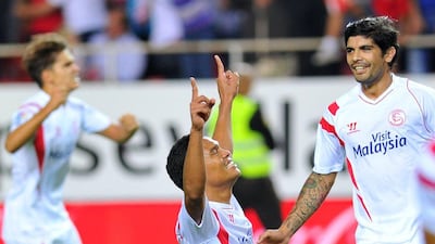 Carlos Bacca celebrates after scoring for Sevilla in their 2-1 win over Villarreal on Sunday night in Seville. Cristina Quicler / AFP / October 26, 2014