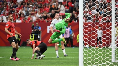 Egypt goalkeeper Mostafa Shobeir saves a shot from New Zealand's Callum McCowatt. Reuters