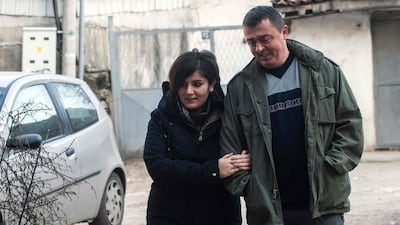 Noora Arkavazi and husband Bobi Dodevski walk outside their building in Kumanovo, Macedonia on December 21, 2016. Robert Atanasovski / Agence France-Presse