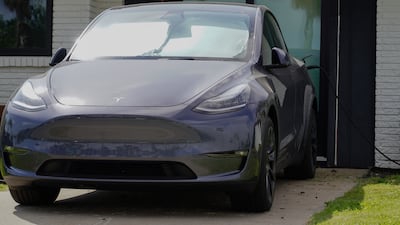 A Tesla charges in the driveway of a house in Boca Chica.