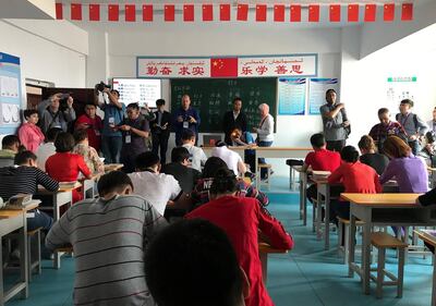 Reporters in a Mandarin class in a vocational centre in Aksu Prefecture