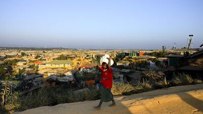 A Rohingya refugee walks back to his home at Balukhali refugee camp in Ukhia. AFP