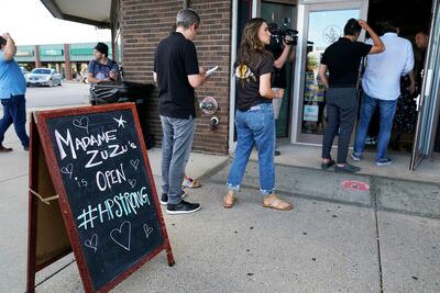 People queue outside Madame Zuzu's in Highland Park, Illinois, for a live-streamed benefit concert hosted by Billy Corgan. AP