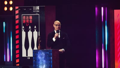 Stanley Tucci presents the award for Album of the Year. EPA