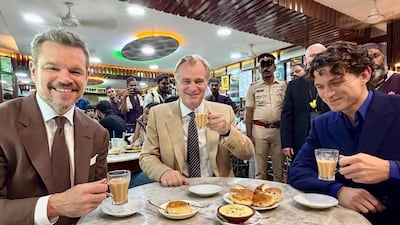 From left: Matt Damon, Christopher Nolan and Tom Holland at Olympia Coffee House in Mumbai. Universal Pictures India / Instagram