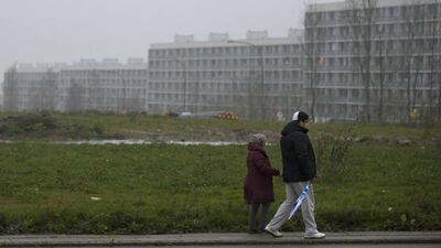 A picture taken on November 14, 2014 in Aarhus shows people walking in one of Denmark's poorest neighbourhoods. Denmark has set up special centres offering rehabilitation for would-be Syria fighters as well as those returning. Bjorn Lindgren/AFP Photo