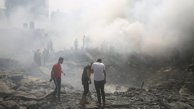 Palestinians look for survivors after an Israeli air strike in Rafah refugee camp in the southern Gaza Strip. AP