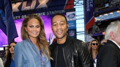 Model Chrissy Teigen, left, and musician John Legend attend Super Bowl XLIX at University of Phoenix Stadium on February 1, 2015 in Glendale, Arizona. Karl Walter / Getty Images / AFP