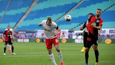 Lukas Klostermann of Leipzig heads home against Hertha Berlin to make the score 1-1 in the Bundesliga match at the Red Bull Arena, on May 27, 2020. AFP