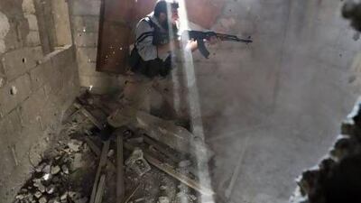 Heavy fighting continues in Syria. A fighter from the Free Syrian Army's Tahrir Al Sham brigade fires back at the Syrian army in Damascus.