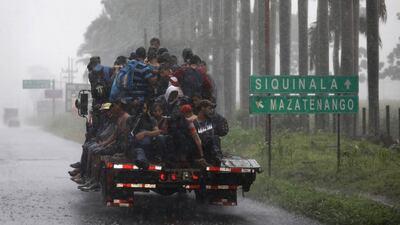 People in a migrant caravan make their way through Guatemala towards the border with Mexico. Getty Images