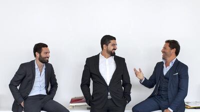 Simon Hacker, Khalid Ali and Mimoun Assraaoui at the office of Alpha Nero, a Dubai-based business that manufactures retail displays. Anna Nielsen for The National.