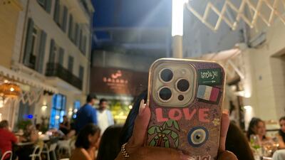 Flags on a phone illustrate a summer friendship. Mohamad Ali Harisi / The National