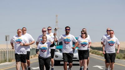 The torch runners hit the road on the penultimate day of the Flame of Hope tour.
