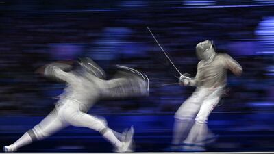 Hungary's Andras Szatmari, left competes against South Korea's Gu Bon-gil in the men's sabre team gold medal bout at the Grand Palais in Paris, on July 31. AFP