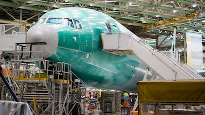 A Boeing 777X airplane sits on the assembly floor at at the company's facility in Everett, Washington, US. Boeing is assessing the possibility of conducting the plane's first test flight on January 24, after weather conditions forced it to delay the original schedule of Jan 23. Bloomberg.