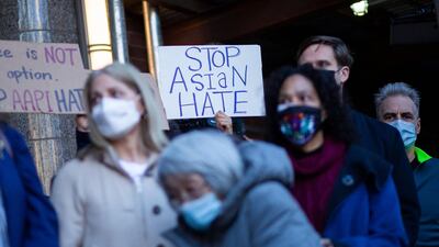 People attend an Asian-American anti-violence event outside the building were a 65-year-old Asian woman was attacked in New York City. AFP