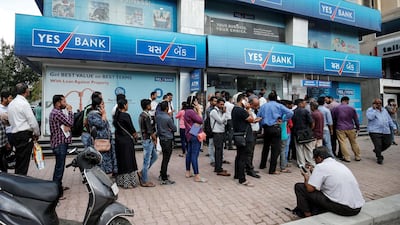 Customers queueing outside a Yes Bank branch to withdraw their money in Ahmedabad, India, earlier this month. State Bank of India is paying 10 rupees per share as part of a rescue deal for the troubled lender. Reuters