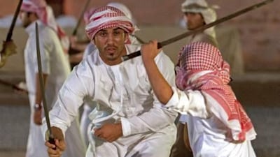 Young men display their swordsmanship during a demonstration before the start of the Al Saif Traditional Sword Competition in Fujairah yesterday.